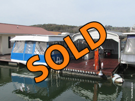 10 x 38 Floating Cabin Approx 380sqft Constructed on 1974 Captains Craft 13 x 54 Steel Hull Houseboat with Large Dock with Covered Boat Slip and Front Mount Boat Lift and Shore Power For Sale on Norris Lake at Cedar Grove Marina